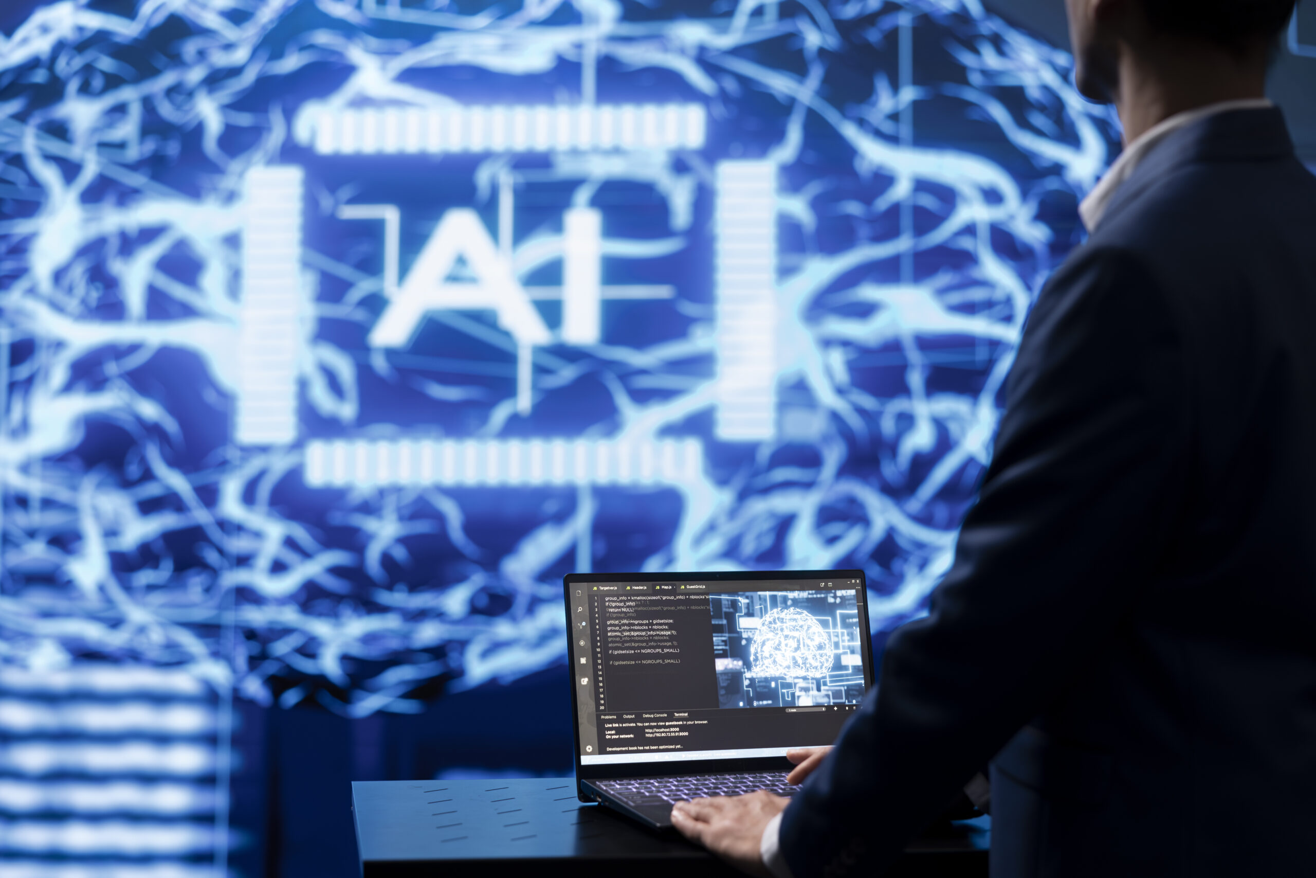 Programmer using AI cognitive computing to extract usable information from complex data on laptop. Employee using artificial intelligence tech on notebook to accelerate complex calculations